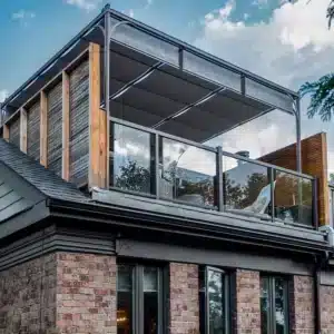 An Attached Silhouette Aluminum Patio Cover shading a rooftop deck space